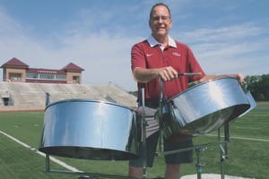Brad Shores shows off some of his steel-drum chops with Thresher Stadium as the backdrop.