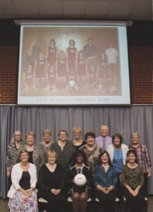 At this year’s Hall of Fame Banquet, the 1976 women’s volleyball team arranged themselves in the same positions as in the team photo (on screen above their heads) taken 40 years earlier. Front row, from left: Barb Unruh (Beachy), Marcia Kroeker (Miller), Cynthia Alexander (Doyle Perkins), Minnie Wiens and Cynthia Habegger (Loganbill); back: student manager Sheri Unruh (Campos), Annette Stucky (Epp), Sandy Kaufman (Stephenson), Rhonda Wedel, Lori Erb (Thimm), Jill Ewert (Backhus), assistant coach Rich Harder, Margie Harder (Wiens) and coach Barb Graber.