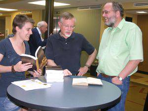 From left, Audra Miller, John Thiesen and Mark Jantzen at the book celebration for The Military Service Exemption of the Mennonites of Provincial Prussia. Photo by Melanie Zuercher