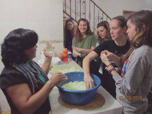Bethel students learn to make pupusas, the ultimate Salvadoran comfort food, from an immigrant to Mexico from El Salvador (from left, Tia Goertzen, Koki Lane, unidentified non-Bethel student, Leah Mueller)