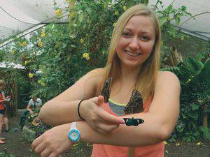 Lisa Goering with a new friend in a mariposario (butterfly garden) in Mindo, Ecuador