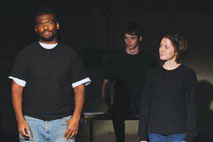 Lucky, an inmate of Hutchinson Correctional Facility, left, and Katie Schmidt, Bethel junior (with freshman Isaac Dunn in the background), rehearse a scene from Inside Story, which they performed at HCC in late January. Photo by Audra Miller.