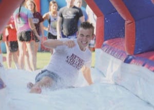 Tuesday, Aug. 16, 5:17 p.m., the Green Slip-slidin’ away: senior Ryan Ford enjoys one of the inflatables at the block party on the Green that was the culmination of Thresher Days, the orientation period right before the start of fall classes.
