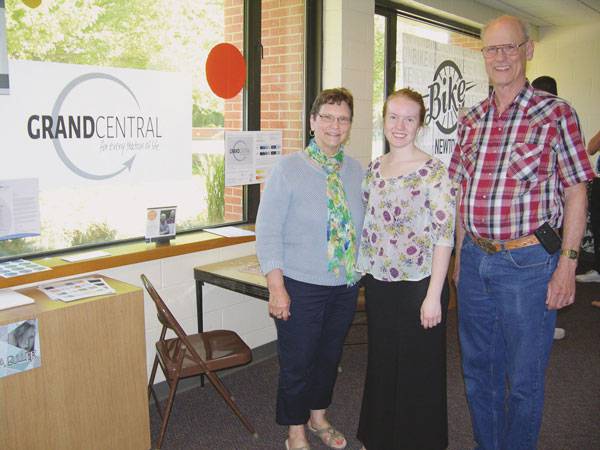 To fulfill her class requirement, graphic design student Sondra Buller worked with a paying client, the Newton Area Senior Center, which had changed its name to Grand Central. Pictured, from left, are Donna Becker ’70, Grand Central board chair, Buller and Bob Becker ’69.