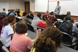 Alumni such as Tyler Schroeder ’10, pictured here, regularly visit Bethel business classes to talk about career opportunities.  Photo by Vada Snider.