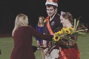 Seniors Melinda Regehr and Tanner Steingard accept their crowns from Dalene White