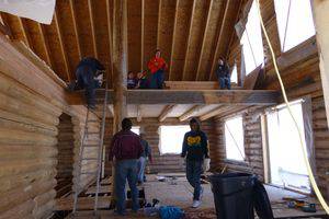 Bethel students work on a log house in Joplin, Mo.; from left, top level: (unidentified on ladder), Emily Simpson, Leah Towle, Koki Lane and Konner Davison; bottom level: Michael Bowman, Vice President for Student Life Aaron Austin and Michael Clark